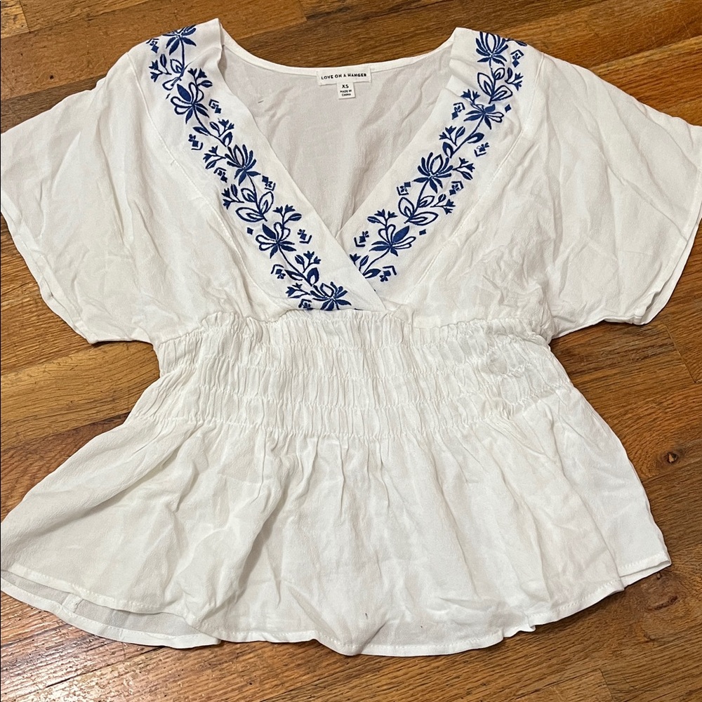 love on a hanger White Peasant Blouse with Blue Floral Embroidery